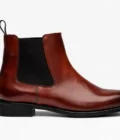 Crafted from rich brown leather with a smooth, refined finish, this Chelsea boot offers timeless style with everyday versatility. The sleek ankle-high profile features elastic side panels for easy slip-on wear, while the rounded toe and clean stitching create a sophisticated, streamlined look.