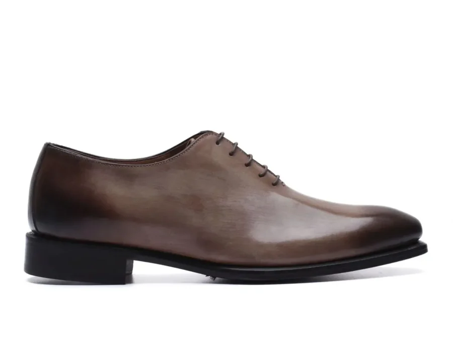 Shop black wholecut Oxford shoes made in Italy, handcrafted from a single piece of premium calfskin leather. Minimal, elegant, and designed for true luxury. Order now